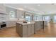 Spacious kitchen with a double island, stainless steel appliances, and natural light offering a chef's dream at 585 Gunwale Ln, Longboat Key, FL 34228