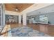 Open concept living room space, featuring hardwood floors, dining room, and kitchen at 585 Gunwale Ln, Longboat Key, FL 34228
