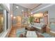 Bright and airy living room with hardwood floors, high ceilings, and open staircase, creating a welcoming atmosphere at 585 Gunwale Ln, Longboat Key, FL 34228