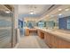 Spacious main bathroom featuring double sinks, a vanity area, and a separate glass-enclosed shower at 585 Gunwale Ln, Longboat Key, FL 34228