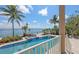 Beautiful pool with spa and tropical landscaping overlooking the serene waterfront at 585 Gunwale Ln, Longboat Key, FL 34228