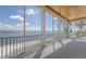 Screened porch area with ocean views at 585 Gunwale Ln, Longboat Key, FL 34228