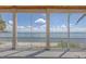 Screened porch view overlooking ocean waters at 585 Gunwale Ln, Longboat Key, FL 34228