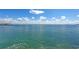Expansive water view showcasing shimmering turquoise waters under a partly cloudy blue sky at 585 Gunwale Ln, Longboat Key, FL 34228