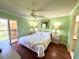Comfortable bedroom with warm wood floors, sliding doors, and a calming, fresh paint color at 6505 Stone River Rd # 309, Bradenton, FL 34203