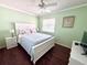 Bedroom with wood floor and window with blinds at 6505 Stone River Rd # 309, Bradenton, FL 34203