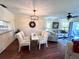 Dining area with table, chairs, ceiling fan and hardwood floors at 6505 Stone River Rd # 309, Bradenton, FL 34203