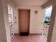 Welcoming elevator entrance with a small black doormat and exterior views at 6505 Stone River Rd # 309, Bradenton, FL 34203
