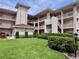 Three-story condo complex with balconies and well-maintained landscaping at 6505 Stone River Rd # 309, Bradenton, FL 34203