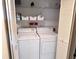 Bright laundry room with white appliances and shelving at 6505 Stone River Rd # 309, Bradenton, FL 34203