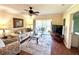 Cozy living room with sliding door access to the balcony at 6505 Stone River Rd # 309, Bradenton, FL 34203