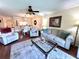 Living room with ceiling fan, hardwood floors and lots of natural light at 6505 Stone River Rd # 309, Bradenton, FL 34203