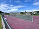 Outdoor tennis court with ample space for recreational sports and community activities at 6505 Stone River Rd # 309, Bradenton, FL 34203