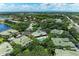 Aerial view featuring community pool and clubhouse surrounded by lush landscaping and well-maintained homes at 6536 Moorings Point Cir # 101, Lakewood Ranch, FL 34202