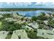 Beautiful aerial view of the community including a pool, clubhouse, and lake access at 6536 Moorings Point Cir # 101, Lakewood Ranch, FL 34202