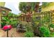 Private backyard patio with landscaping, dining, and bbq area at 6536 Moorings Point Cir # 101, Lakewood Ranch, FL 34202