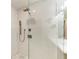 Modern bathroom shower with bronze fixtures, glass enclosure, and decorative tile accents at 6536 Moorings Point Cir # 101, Lakewood Ranch, FL 34202