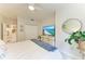 Bright bedroom with a dresser, decor, and comfortable furnishings at 6536 Moorings Point Cir # 101, Lakewood Ranch, FL 34202
