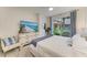 Inviting bedroom with soft blue accents, ample natural light, and a view of the outdoors at 6536 Moorings Point Cir # 101, Lakewood Ranch, FL 34202