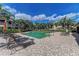 Beautiful community pool surrounded by lush tropical landscaping and lounge chairs, perfect for relaxation and enjoyment at 6536 Moorings Point Cir # 101, Lakewood Ranch, FL 34202