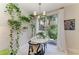 Eat-in-kitchen with large windows providing lots of natural light, decorated with plants at 6536 Moorings Point Cir # 101, Lakewood Ranch, FL 34202