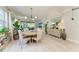 An airy dining room featuring neutral tones, a round table, and a view to the outside at 6536 Moorings Point Cir # 101, Lakewood Ranch, FL 34202