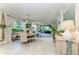 Bright dining area with round table, large windows, and seamless access to the outdoor living space at 6536 Moorings Point Cir # 101, Lakewood Ranch, FL 34202