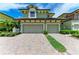 A charming two-story home with a two-car garage and a brick driveway at 6536 Moorings Point Cir # 101, Lakewood Ranch, FL 34202