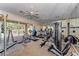 Well-equipped gym with modern exercise equipment, machines, and a view of the outdoors at 6536 Moorings Point Cir # 101, Lakewood Ranch, FL 34202