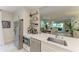 Bright kitchen with stainless appliances, white cabinets, and an open layout at 6536 Moorings Point Cir # 101, Lakewood Ranch, FL 34202