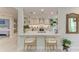 Bright kitchen with white quartz counters and an open breakfast bar perfect for modern living at 6536 Moorings Point Cir # 101, Lakewood Ranch, FL 34202