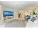 Open-concept living area with a large rug, modern furniture, and seamless flow to the dining and kitchen spaces at 6536 Moorings Point Cir # 101, Lakewood Ranch, FL 34202
