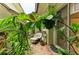 Charming patio with lush greenery, comfortable seating, and a tranquil atmosphere at 6536 Moorings Point Cir # 101, Lakewood Ranch, FL 34202
