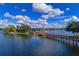 Scenic pier extending into the lake, providing residents with access to boating and other water activities at 6536 Moorings Point Cir # 101, Lakewood Ranch, FL 34202