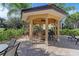 Charming poolside bar area with seating, providing a relaxing space to enjoy refreshments with friends and Gathering at 6536 Moorings Point Cir # 101, Lakewood Ranch, FL 34202
