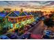 A colorful aerial view of the town lit up as the sun sets over the Gulf at 701 Marbury Lane, Longboat Key, FL 34228