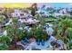 Beautiful aerial view of a waterfront property with a lush backyard, a dock, and plenty of space for relaxation at 701 Marbury Lane, Longboat Key, FL 34228