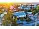 Scenic aerial view of the charming home nestled among lush trees in a beautiful neighborhood at 701 Marbury Lane, Longboat Key, FL 34228