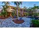 Lush backyard with a sparkling pool, beautiful landscaping, and comfortable seating areas for outdoor enjoyment at 701 Marbury Lane, Longboat Key, FL 34228