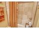 A luxurious bathroom is decorated with sea-themed decor and includes a relaxing bathtub and stall shower at 701 Marbury Lane, Longboat Key, FL 34228
