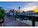 Dock featuring boats and waterfront living, perfect for enjoying scenic views and peaceful surroundings at 701 Marbury Lane, Longboat Key, FL 34228