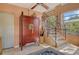 Bright foyer with staircase, large armoire, and ample natural light from nearby windows at 701 Marbury Lane, Longboat Key, FL 34228