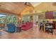 Bright living room with bamboo ceiling, large windows and comfortable seating at 701 Marbury Lane, Longboat Key, FL 34228
