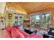 Open living room with vaulted bamboo ceilings, plenty of natural light and inviting decor at 701 Marbury Lane, Longboat Key, FL 34228