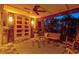 Comfortable porch area with a swing, ceiling fan, and cozy seating, perfect for outdoor enjoyment at 701 Marbury Lane, Longboat Key, FL 34228