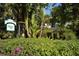 Lush greenery surrounds the sign for 'Euphoria' Restaurant, hinting at an elegant dining experience at 701 Marbury Lane, Longboat Key, FL 34228