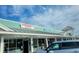 Commercial building with 'Longbeach Cafe' and 'Beach Fitness' signs; retail space in a vibrant location at 701 Marbury Lane, Longboat Key, FL 34228