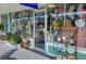 Charming storefront of 'elmwood beach home & garden' with displays of plants, decor and merchandise at 701 Marbury Lane, Longboat Key, FL 34228