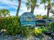 Nautical-themed restaurant sign amidst tropical foliage, inviting guests to a unique dockside dining experience at 701 Marbury Lane, Longboat Key, FL 34228