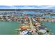 Expansive aerial view of a waterfront community with homes nestled along canals and bay access at 8001 13Th S Ave, St Petersburg, FL 33707